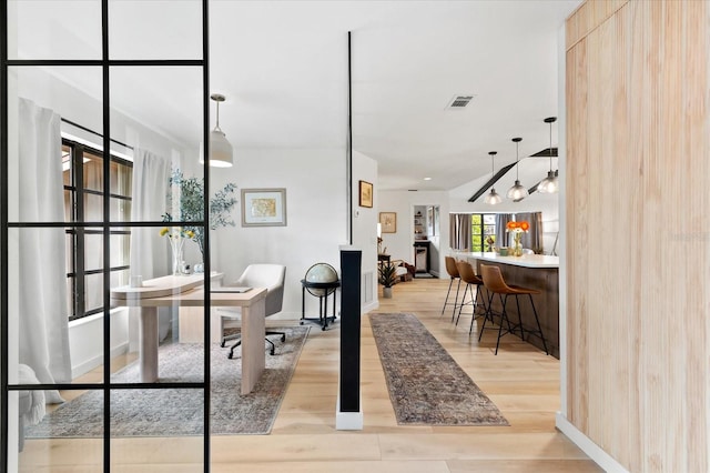 office with light wood-type flooring