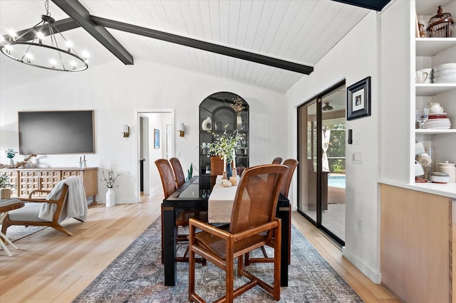 dining space featuring vaulted ceiling with beams, wood ceiling, light hardwood / wood-style floors, and a chandelier