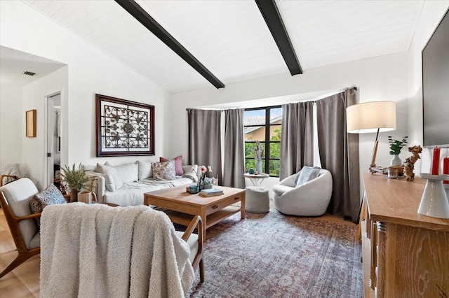 living room with wood-type flooring and vaulted ceiling with beams