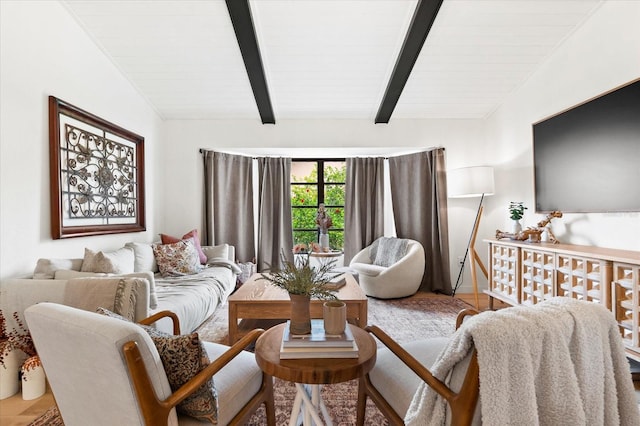 living room with vaulted ceiling with beams