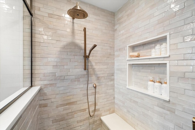 bathroom with a tile shower