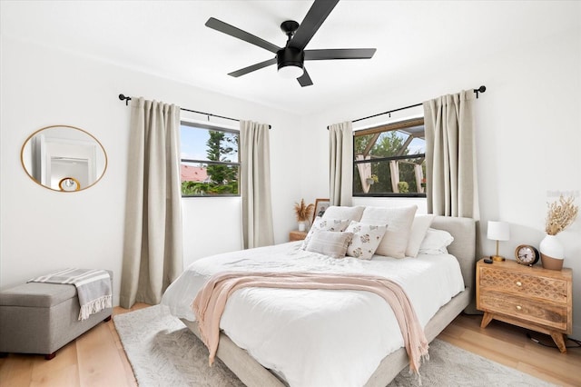 bedroom featuring light hardwood / wood-style floors and ceiling fan