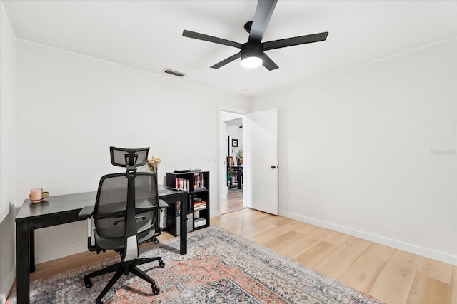 office space featuring hardwood / wood-style flooring and ceiling fan