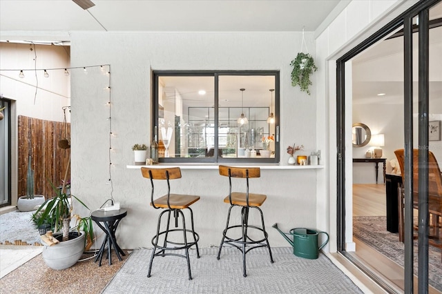 bar featuring white cabinetry