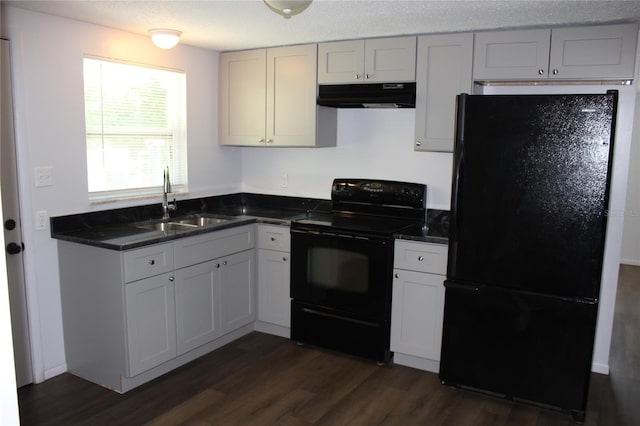 kitchen with white cabinets, dark hardwood / wood-style floors, black appliances, and sink