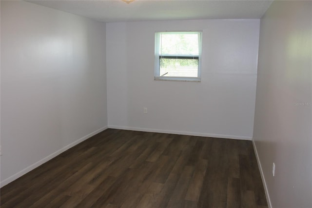 spare room with hardwood / wood-style floors