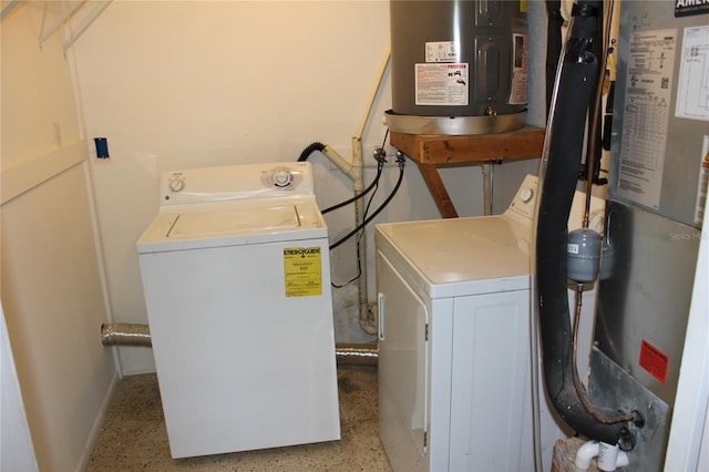 laundry room with washer and clothes dryer, water heater, and gas water heater