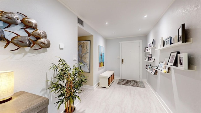 interior space with crown molding and tile patterned floors