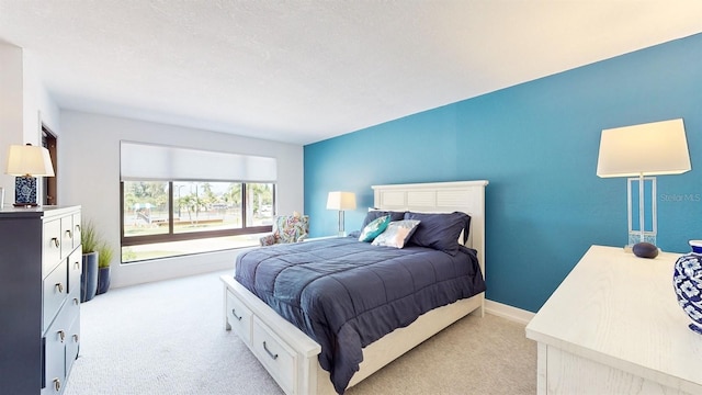 carpeted bedroom with a textured ceiling