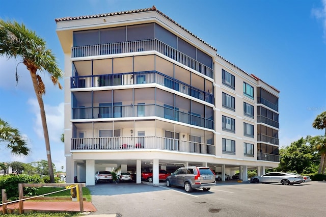 view of building exterior with covered parking