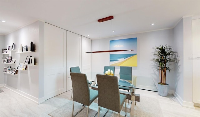 dining area featuring baseboards, recessed lighting, and crown molding