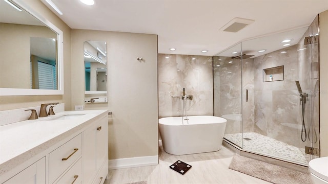 bathroom featuring a shower with door, toilet, tile patterned floors, and vanity