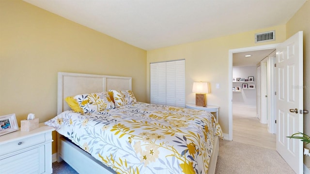 bedroom featuring light colored carpet, visible vents, and baseboards