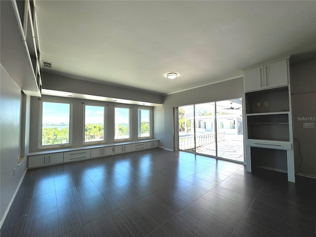 spare room with dark tile patterned flooring