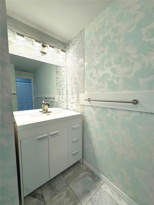 bathroom featuring tile patterned floors and vanity