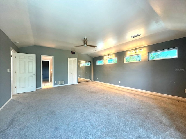 interior space with lofted ceiling and ceiling fan