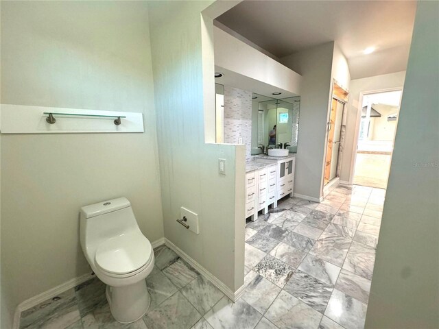 bathroom featuring double vanity, tile patterned flooring, and toilet