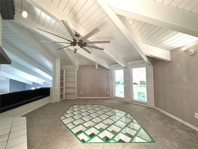 additional living space featuring ceiling fan, lofted ceiling with beams, and carpet