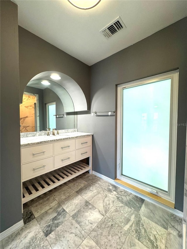 bathroom with vanity and tile patterned flooring