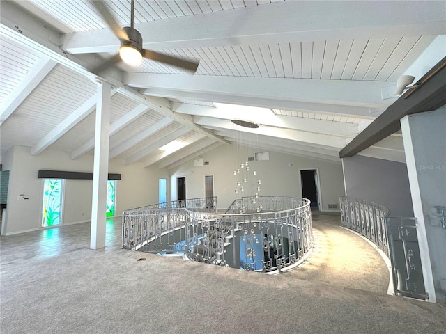 interior space featuring ceiling fan, lofted ceiling with beams, and tile patterned flooring