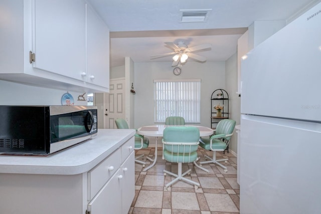 dining area featuring light tile patterned flooring and ceiling fan