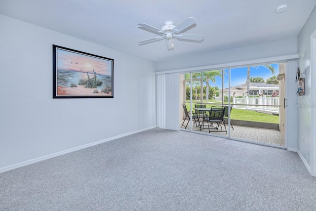 carpeted empty room with ceiling fan