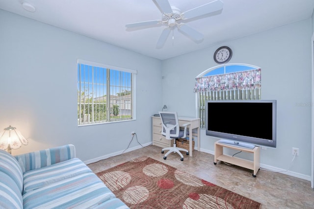 office space with ceiling fan and light tile patterned floors