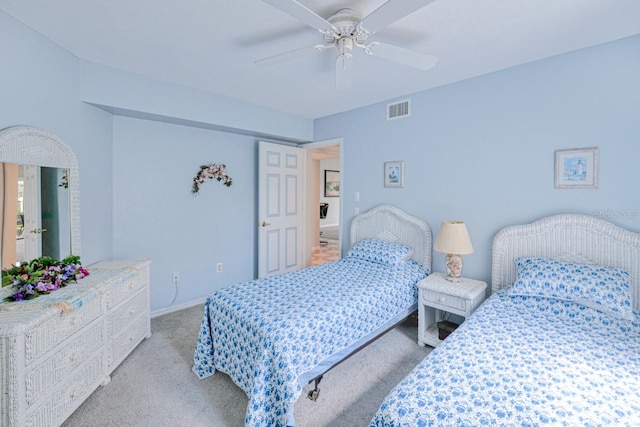 bedroom featuring ceiling fan and light carpet