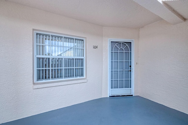 property entrance with a patio area