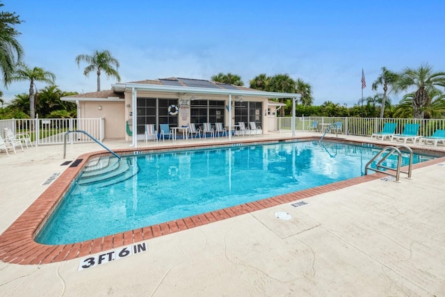 view of swimming pool featuring a patio area