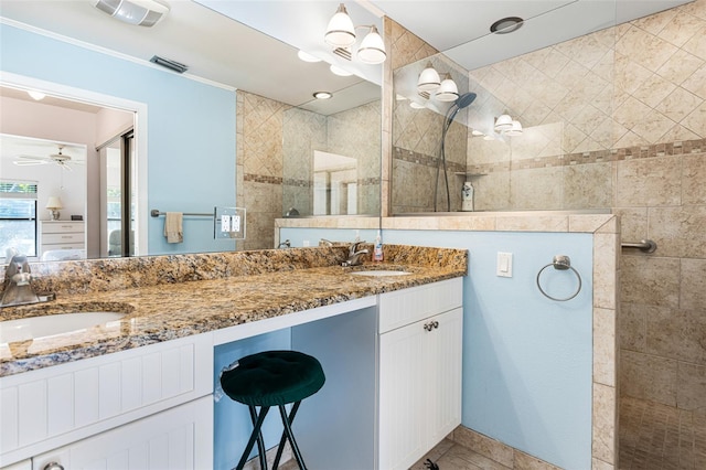 bathroom featuring ceiling fan, tile patterned floors, and dual vanity