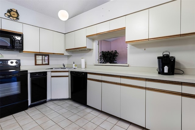 kitchen featuring white cabinets, light tile patterned floors, sink, and black appliances