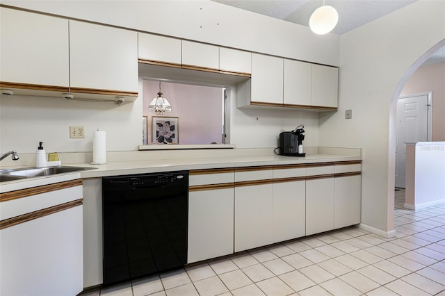 kitchen with light tile patterned floors, hanging light fixtures, white cabinets, dishwasher, and sink