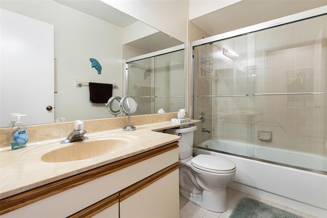 full bathroom with enclosed tub / shower combo, toilet, tile patterned floors, and vanity