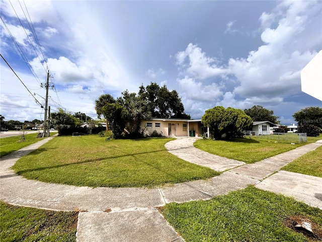 ranch-style house with a front lawn