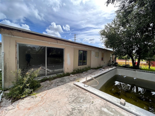 rear view of house featuring a patio