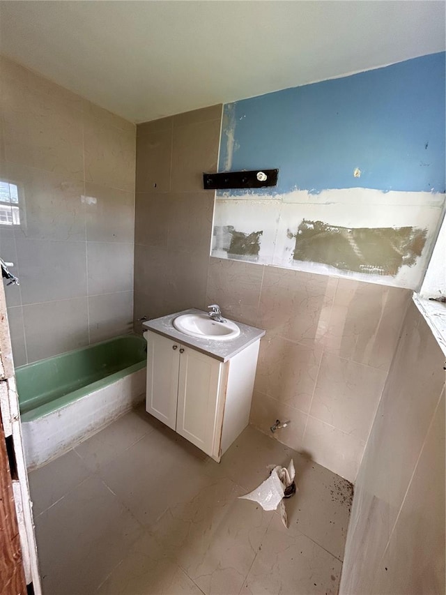 bathroom featuring vanity, tile walls, and tile patterned flooring