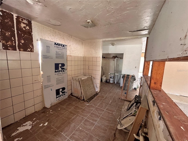 bathroom featuring tile walls and tile patterned floors