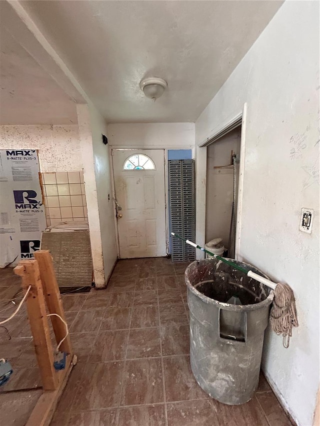 entryway with tile patterned floors