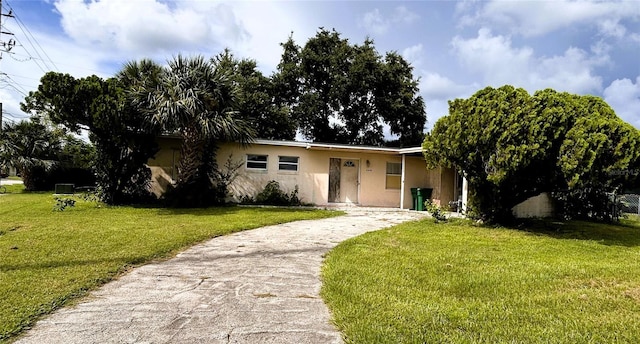 ranch-style home with a front yard