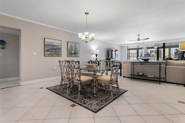 dining space with ornamental molding, ceiling fan with notable chandelier, light tile patterned floors, and a textured ceiling