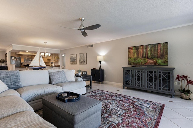 living room featuring light tile patterned floors, crown molding, and a textured ceiling