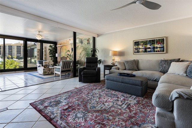 tiled living room with ceiling fan, a wall of windows, an AC wall unit, and a textured ceiling