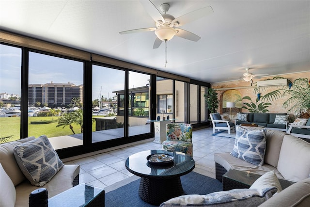 sunroom featuring a wall mounted air conditioner, a wealth of natural light, and ceiling fan