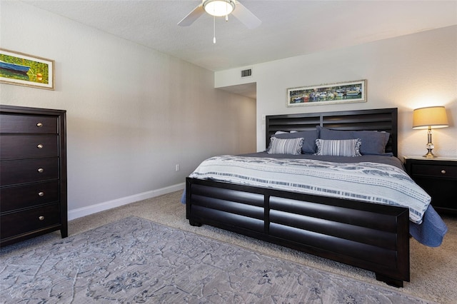 bedroom featuring light carpet and ceiling fan