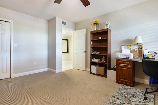 office space with ceiling fan and light colored carpet