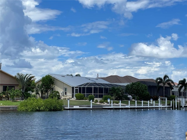 view of water feature with a dock and a residential view