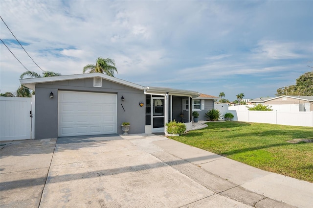 single story home featuring a garage and a front lawn