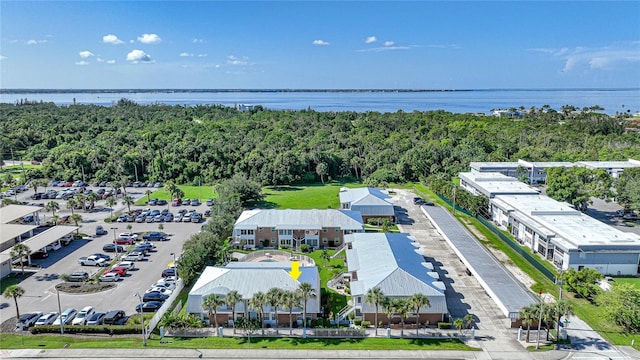 birds eye view of property with a water view