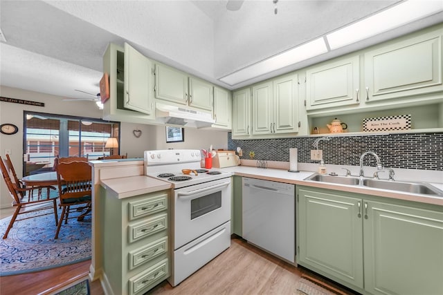 kitchen with ceiling fan, backsplash, light wood-type flooring, white appliances, and sink